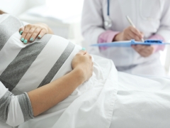  Pregnant patient talking to her provider. 